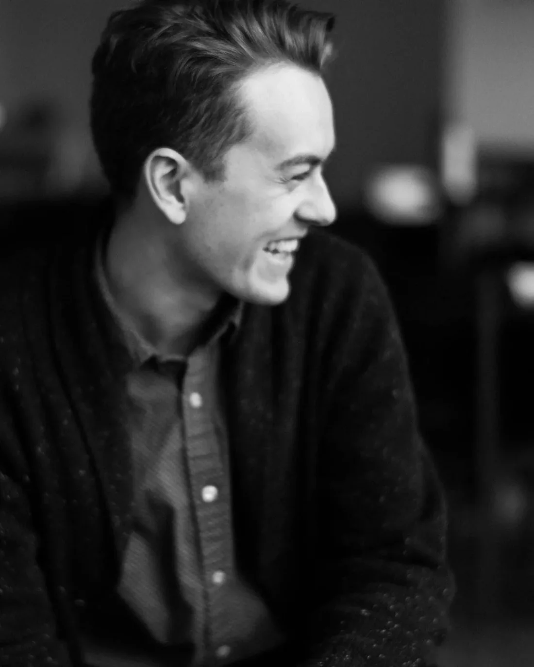 Josh Olson, wedding photographer, photographed with his camera